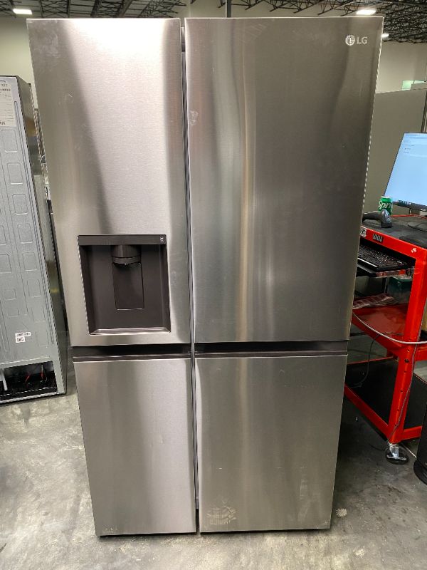 Photo 2 of LG 27.6-cu ft Side-by-Side Refrigerator with Ice Maker (Printproof Stainless Steel) -- minor scratches small dents from transport 