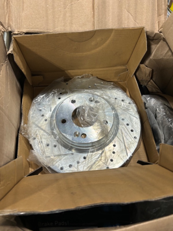 Photo 3 of AutoShack PR65099DSZPR Front Drilled Slotted Brake Rotors Silver Pair of 2 Driver and Passenger Side Replacement for GMC Sierra 1500 Yukon XL Chevrolet Tahoe Suburban 1500 2005-2019 Silverado 1500 4WD