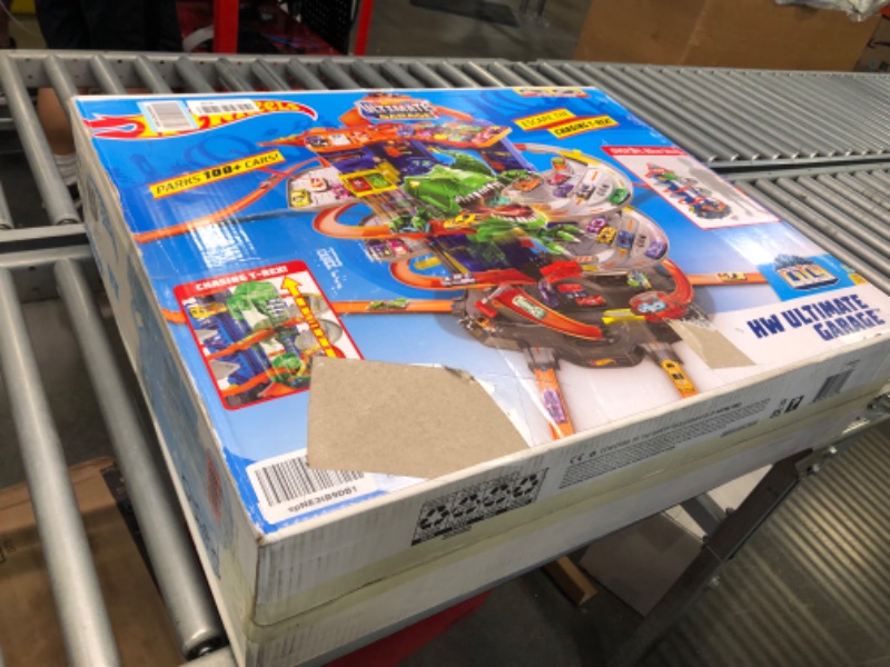 Photo 1 of Hot Wheels Track Set, Ultimate Garage Toy Vehicle Playset With Moving T-Rex Dinosaur, Storage For 100+ Vehicles, 3ft+ Tall