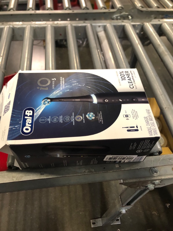 Photo 2 of Oral-B iO Series 5 Electric Toothbrush with (1) Brush Head, Rechargeable, Black Black 1 Count (Pack of 1)