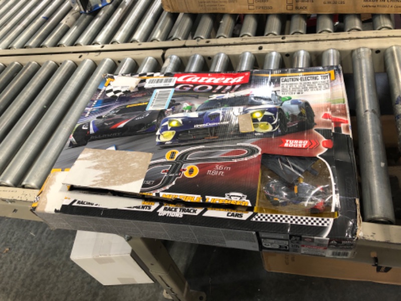 Photo 3 of Carrera GO!!! 62521 onto The Podium Electric Powered Slot Car Racing Kids Toy Race Track Set Includes 2 Hand Controllers and 2 Cars in 1:43 Scale