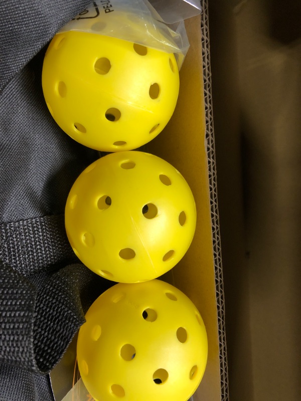 Photo 1 of Portable Pickleball Net on Wheels, 22FT Standard Pickleball Net for Driveway Backyard, Strong PE Net, Metal Frame, 4 Balls, 1 Carry Bag, Pickleball Net System for Indoor & Outdoor Play