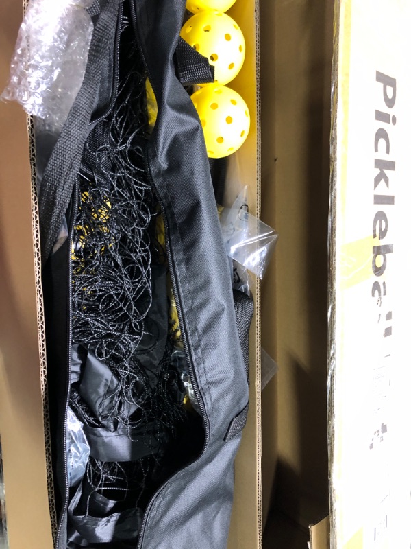 Photo 1 of Portable Pickleball Net on Wheels, 22FT Standard Pickleball Net for Driveway Backyard, Strong PE Net, Metal Frame, 4 Balls, 1 Carry Bag, Pickleball Net System for Indoor & Outdoor Play