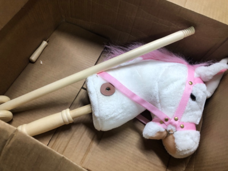 Photo 2 of HollyHOME Plush Unicorn Stick Horse with Wood Wheels Real Pony Neighing and Galloping Sounds Plush Toy Pink 37 Inches(AA Batteries Required)