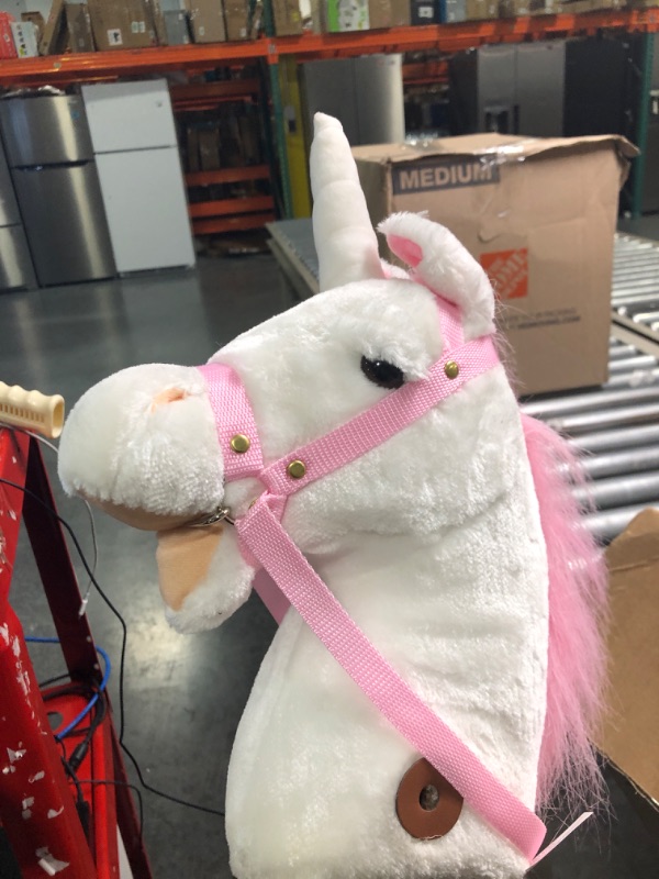 Photo 3 of HollyHOME Plush Unicorn Stick Horse with Wood Wheels Real Pony Neighing and Galloping Sounds Plush Toy Pink 37 Inches(AA Batteries Required)