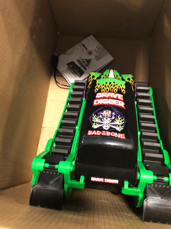 Photo 3 of Monster Jam, Official Grave Digger Trax All-Terrain Remote Control Outdoor Vehicle, 1:15 Scale, Kids Toys for Boys and Girls Ages 4 and up Grave Digger 1:15 Rc (Trax)