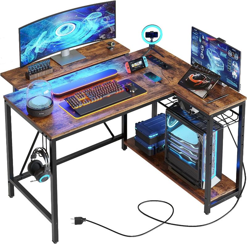 Photo 1 of Bestier Small L Shaped Gaming Desk with Power Outlets,42 inch LED Computer Desk with Monitor Stand Reversible Storage Shelves Corner Gamer Desk with Headset Hooks USB Charging Port,Carbon Fiber Black
