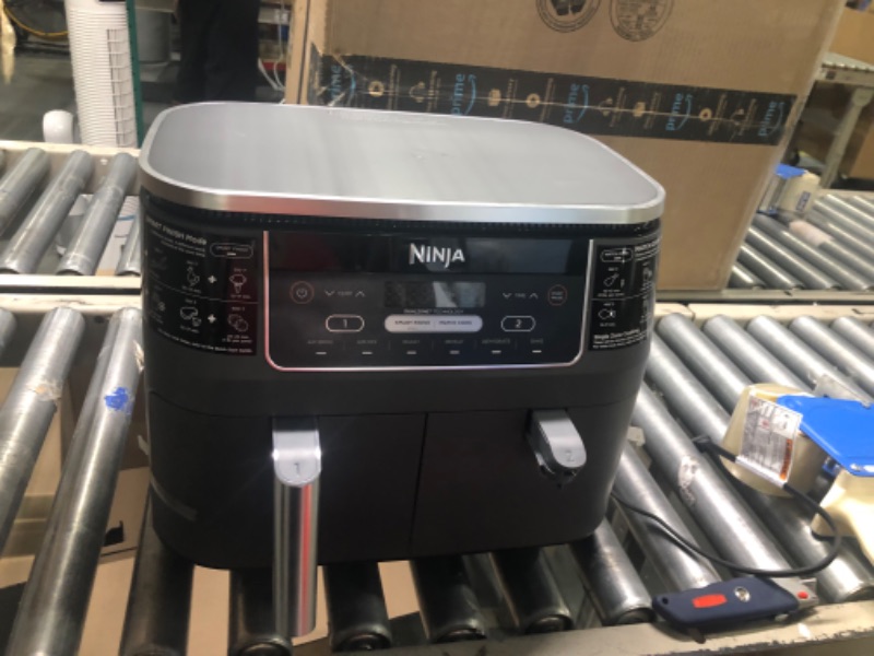 Photo 1 of Ninja DZ201 Foodi 8 Quart 6-in-1 DualZone 2-Basket Air Fryer with 2 Independent Frying Baskets, Match Cook & Smart Finish to Roast, Broil, Dehydrate & More for Quick, Easy Meals, Grey