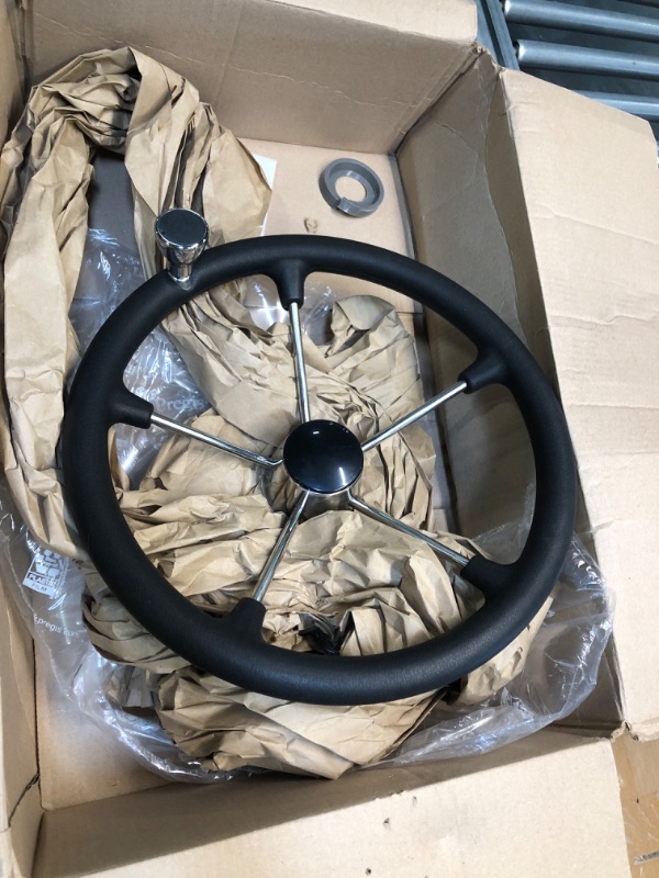 Photo 1 of black/chrome steering wheel with built in turning assist knob