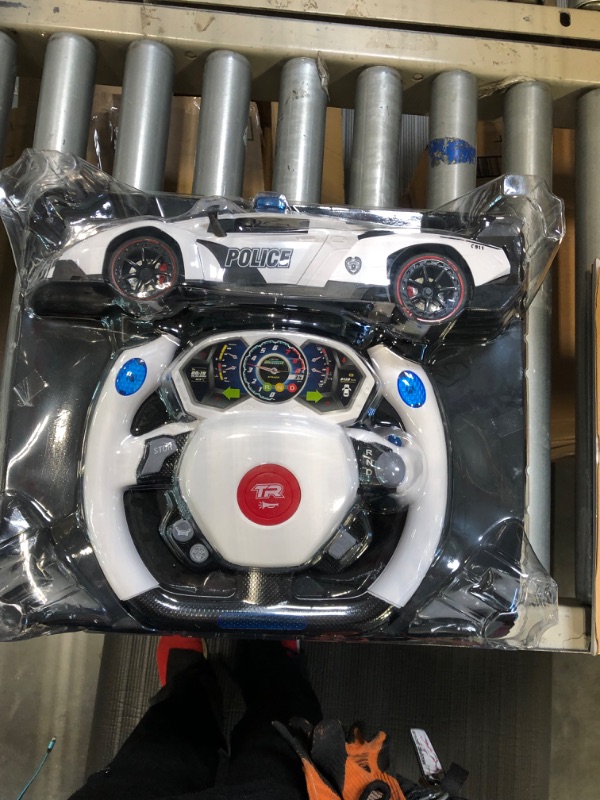 Photo 1 of Remote Control Police Car, 4D Motion Gravity and Steering Wheel Control, 1:12 Scale, 2.4Ghz, with Lights, Sirens, Powered Doors, (TR-911)