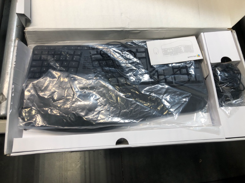 Photo 1 of Microsoft Ergonomic Desktop - Black - Wired, Comfortable, Ergonomic Keyboard and Mouse Combo, with Cushioned Wrist and Palm Support. Split Keyboard. Dedicated Office Key.