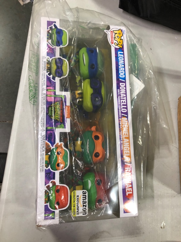 Photo 2 of Funko Pop! Movies: Teenage Mutant Ninja Turtles: Mutant Mayhem - Ninja Turtles 4-Pack (Glow in The Dark), Amazon Exclusive