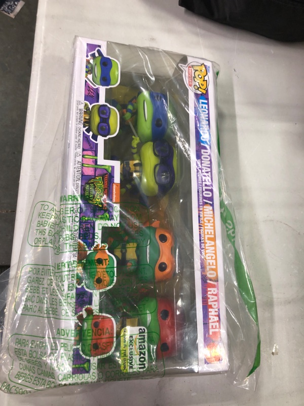 Photo 2 of Funko Pop! Movies: Teenage Mutant Ninja Turtles: Mutant Mayhem - Ninja Turtles 4-Pack (Glow in The Dark), Amazon Exclusive