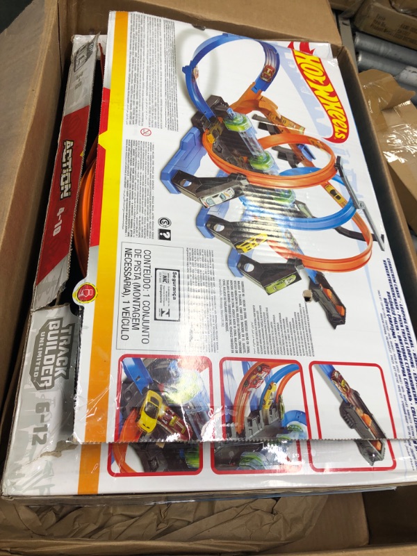Photo 1 of Hot Wheels Track Set and Toy Car, Large-Scale Motorized Track with 3 Corkscrew Loops, 3 Crash Zones and Toy Storage??