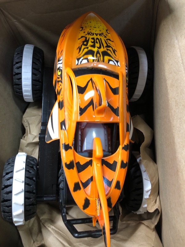 Photo 3 of Hot Wheels Monster Trucks, Remote Control Car, Monster Truck Toy with All-Terrain Wheels, 1:15 Scale Unstoppable Tiger Shark RC