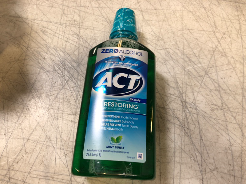 Photo 2 of ACT Restoring Zero Alcohol Fluoride Mouthwash 33.8 fl. oz. Strengthens Tooth Enamel, Mint Burst Green 33.8 Fl Oz (Pack of 1)