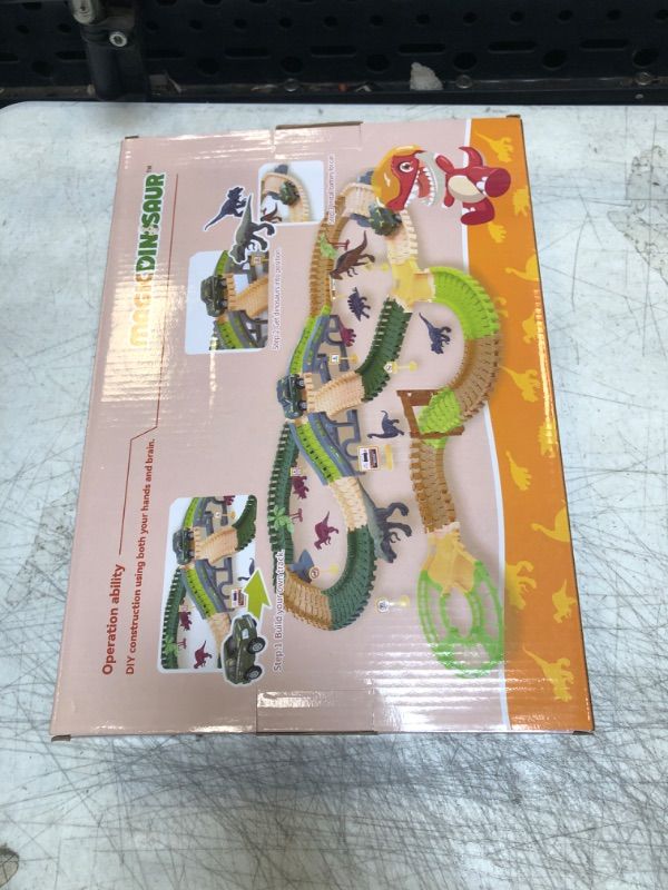 Photo 2 of Dinosaur Tracks Toy for Kids 3 4 5 6 Years and Up, Create A Dino World Road Race, 239 Pieces Bendable and Flexible Tracks with Dinosaur Figures, Viaduct, Trees and 2 Electric Cars
