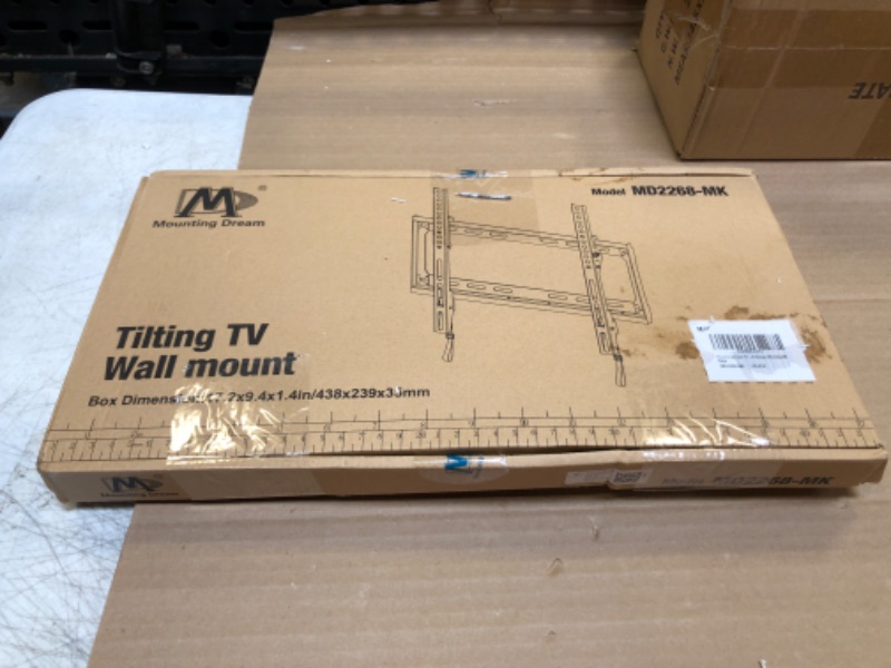 Photo 2 of Mounting Dream Tilting TV Mounts for Most 26-55 Inch LED, LCD TVs up to VESA 400 x 400mm and 88 LBS Loading Capacity, TV Wall Mount with Unique Strap Design for Easily Lock and Release MD2268-MK