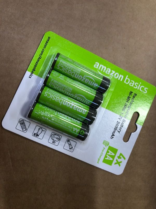 Photo 2 of Amazon Basics 4-Pack Rechargeable AA NiMH High-Capacity Batteries, 2400 mAh, Recharge up to 400x Times, Pre-Charged 4 Count (Pack of 1) ----------------factory sealed 
