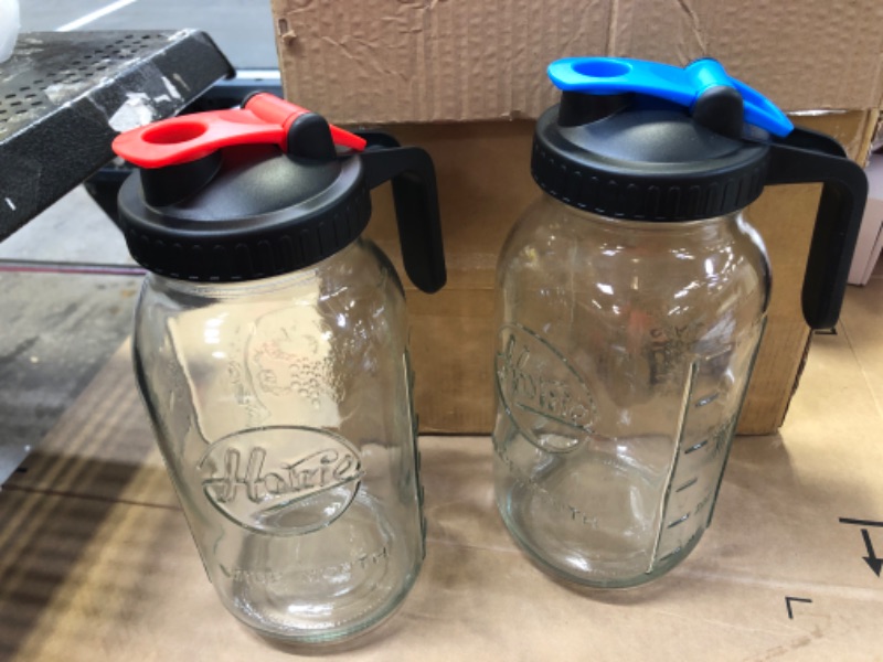 Photo 2 of Tebery 2 Pack Wide Mouth Half Gallon Glass Mason Jar Pitcher with Handle Lids, 64Oz Water Carafe Jug Juice Mixing Pitcher for Iced Tea, Sun Tea, Lemonade, Coffee