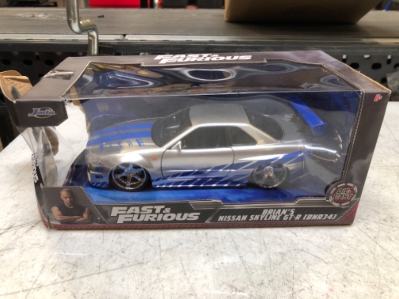 Photo 2 of Jada Toys Fast & Furious Brian’s 2002 Nissan Skyline R34 Die-cast Car, 1:24 Scale, Silver & Blue,19808