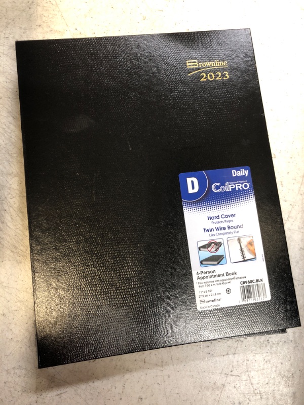 Photo 2 of Brownline 2023 CoilPro Daily Professional Planner, Four-Person Appointment Book, 12 Months, January to December, Twin-Wire Binding, 11" x 8.5", Black (CB960C.BLK-23)