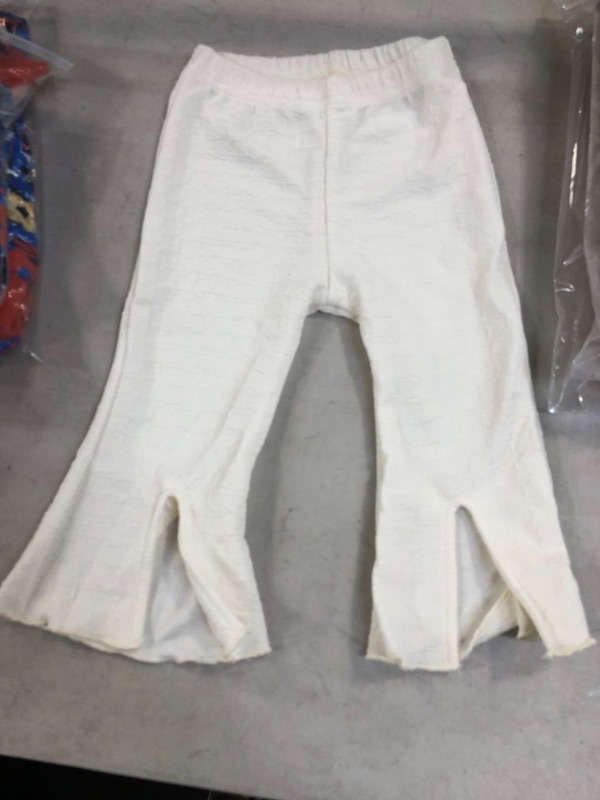 Photo 1 of cream colored baby pants size 110