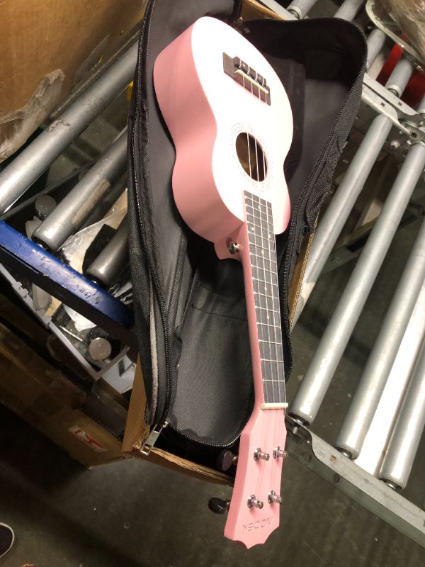 Photo 4 of Donner Concert Ukulele Beginner Kit 23 inch Ukelele Mahogany Wood with Free Online Lesson Gig Bag Strap Nylon String Tuner Picks Ukalalee Yukalalee Bundle Pack DUC-200 Concert Pink