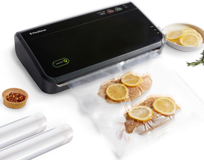 Photo 1 of FoodSaver Vacuum Sealer Machine with Automatic Bag Detection, Sealer Bags and Roll, and Handheld Vacuum Sealer for Airtight Food Storage and Sous Vide, Black
