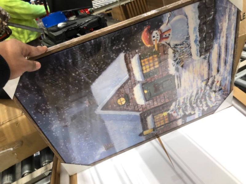 Photo 1 of ArtbyHannah 16x24 Inch Framed Snowman Christmas Wall Art Decor Winter Paintings, Textured 3D Village House on Canvas for Living Room Bedroom Decoration as Holiday Christmas Gifts Christmas Evening Yard 16x24 IN