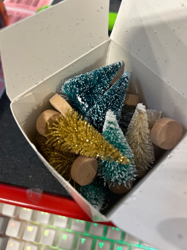 Photo 1 of 24 Pieces Mini Pine Trees Christmas Trees Bottle Brush Trees Frosted Sisal Trees with Wooden Base Miniature Trees Plastic Winter Snow Ornaments Tabletop Trees for Craft Display Decor (Multi-Color) Multicolor