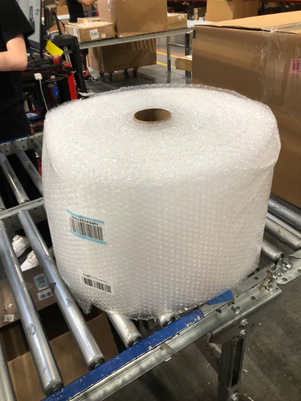 Photo 1 of Amazon Basics Perforated Bubble Cushioning Wrap, Small 3/16", 12-Inch x 175 Foot Long Roll, Clear