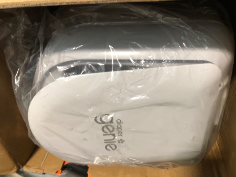 Photo 1 of Diaper Genie Platinum Pail (Lilly White) is Made of Durable Stainless Steel and Includes 1 Easy Roll Refill with 18 Bags That can Last up to 5 Months.