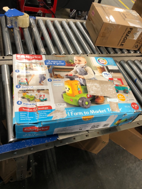 Photo 1 of Fisher-Price Laugh & Learn Baby to Toddler Toy, 4-in-1 Farm to Market Tractor Ride On with Pull Wagon & Smart Stages for Ages 9+ Months