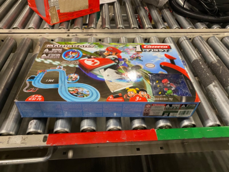 Photo 2 of Carrera First Nintendo Mario Kart Slot Car Race Track - Includes 2 Cars: Mario and Luigi and Two-Controllers - Battery-Powered Beginner Set for Kids Ages 3 Years and Up, 20063028 Mario Kart / Flippers