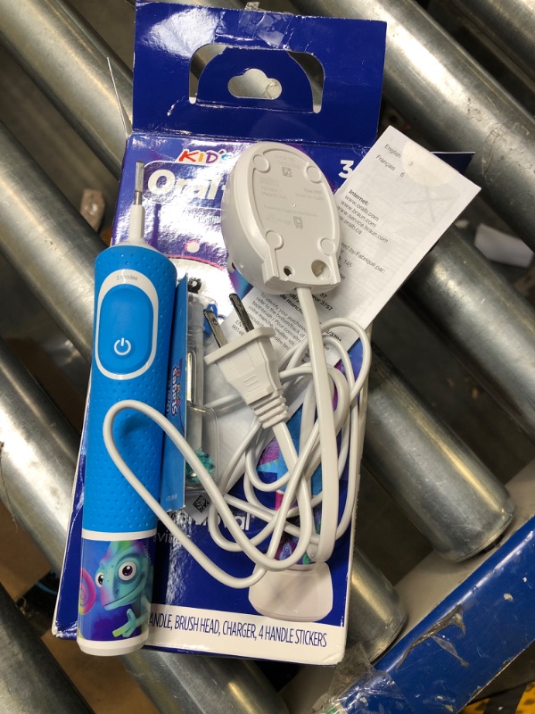 Photo 3 of Oral-B Kid's Electric Rechargeable Toothbrush with Charger, Featuring Extra Soft Color Changing Bristles, for Ages 3, White/Blue