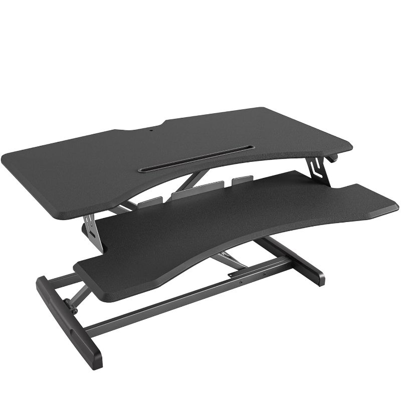 Photo 1 of FEZIBO Standing Desk with Height Adjustable 37 Inches Standing Desk Converter Stand up Riser Tabletop Workstation Fits Dual Monitor 
