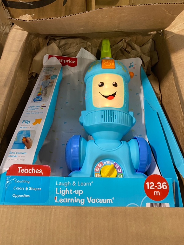 Photo 3 of Fisher-Price Laugh & Learn Toddler Toy Vacuum, Push Toy with Lights Music and Educational Songs, Light-Up Learning