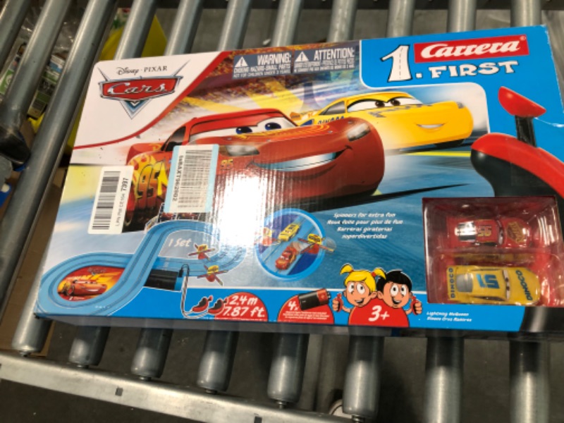 Photo 2 of Carrera First Disney/Pixar Cars - Slot Car Race Track - Includes 2 Cars: Lightning McQueen and Dinoco Cruz - Battery-Powered Beginner Racing Set for Kids Ages 3 Years and Up Disney Cars w/ Spinners