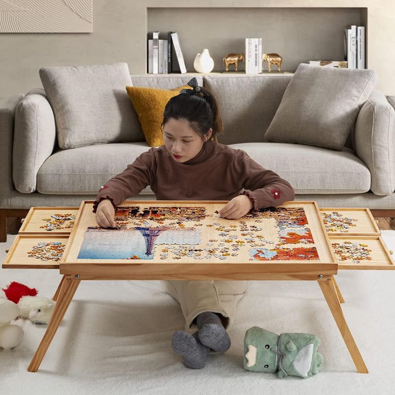 Photo 1 of 1500 Piece Wooden Jigsaw Folding Puzzle Board, Puzzle Table with Legs and Protective Cover, 34” X 26.3” Jigsaw Puzzle Board with 4 Drawers & Cover, Portable Puzzle Tables for Adults and Children
