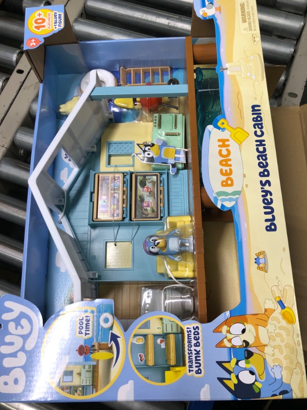 Photo 3 of BLUEY Beach Cabin Playset, with Exclusive Figure with Goggles. Includes 10 Play Pieces and Sticker Sheet