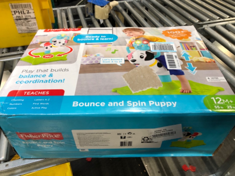 Photo 1 of Fisher-Price Toddler Ride-On Learning Toy, Bounce and Spin Puppy, Stationary Musical Bouncer for Babies and Toddlers Standard