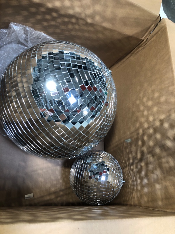 Photo 2 of 2 Pack Large Disco Ball Silver Hanging Mirror Disco Ball Reflective Mirror Disco Ball Ornament for Party Holiday Wedding Dance Music Festivals Decor Club Stage Props DJ Decoration (8 Inch, 16 Inch)