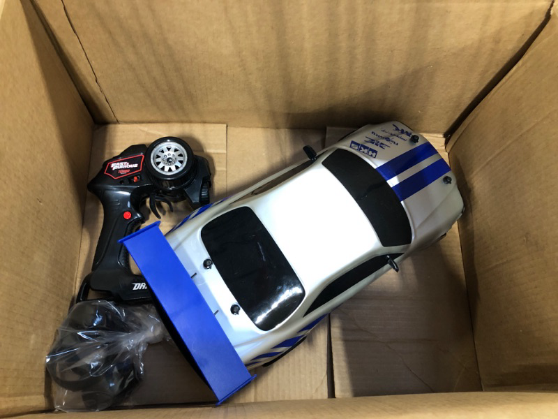 Photo 1 of Jada Toys Fast & Furious Brian's Nissan Skyline GT-R (BN34) Drift Power Slide RC Radio Remote Control Toy Race Car with Extra Tires, 1:10 Scale, Silver/Blue (99701)