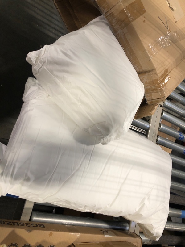 Photo 1 of 2 king sized pillows 