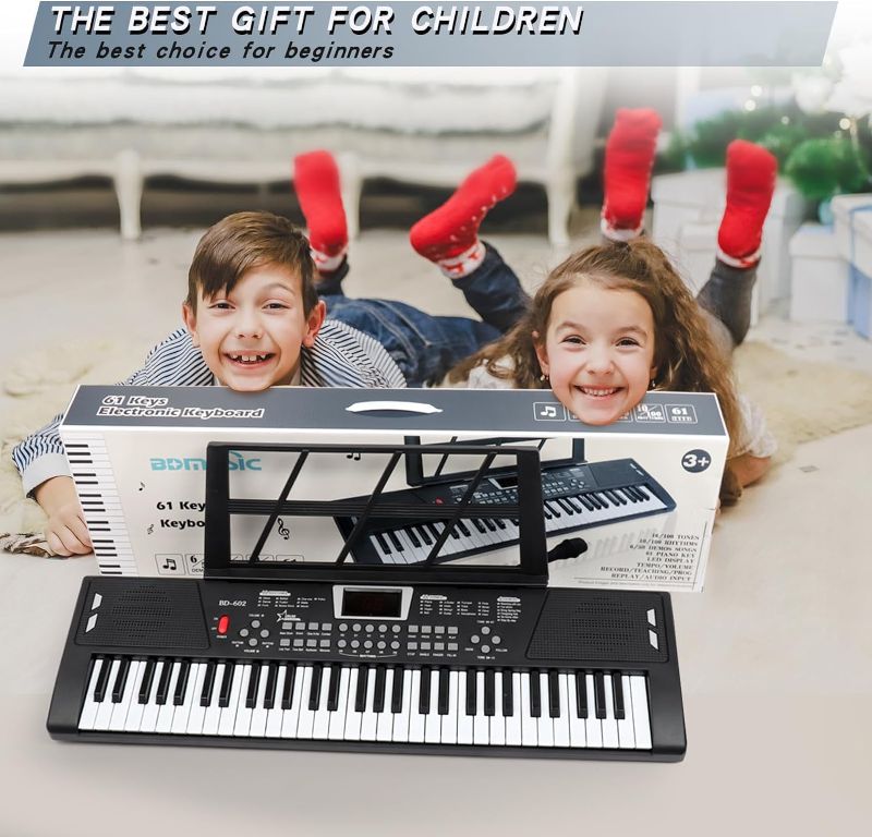 Photo 1 of  Piano Keyboard - 61 Key Keyboard Piano, Electric Piano Music Keyboard with Teaching Mode, Microphone, Sheet Music Stand and Power Supply, portable keyboard piano for Beginners