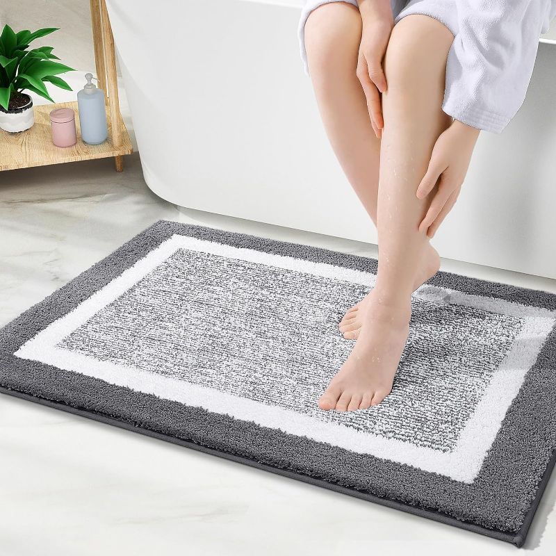 Photo 1 of B0C38WJ9GOLANLY Bathroom Rugs 24x16, Extra Soft and Absorbent Microfiber Bath Mat, Non-Slip, Machine Washable, Quick Dry Bath Carpet, Suitable for Bathroom Floor, Tub, Shower (Dark Grey and White