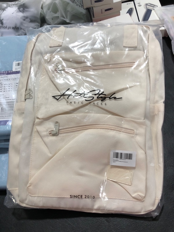 Photo 1 of cream white backpack 