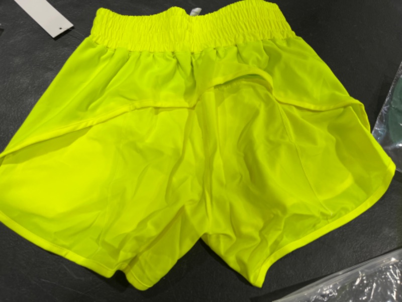 Photo 2 of Aurefin Running Shorts for Women, High Wasited Athletic Shorts with Liner and Zip Pocket Womens Workout Shorts 4 inch SIZE XSMALL. STOCK PHOTO FOR REFERENCE ONLY! ITEM COLOR IS BRIGHT YELLOW. 