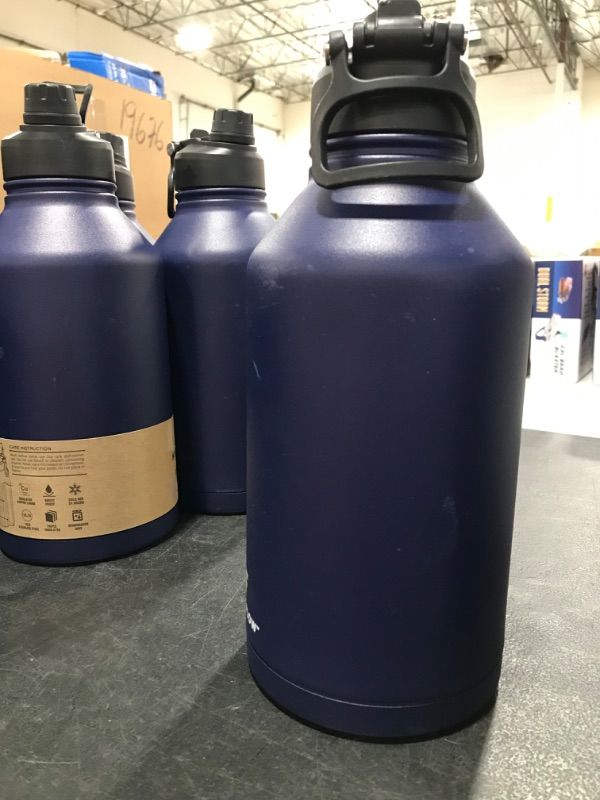 Photo 1 of **handle is broken will need a new lid** Hydraflow Crusader - Triple Wall Vacuum Insulated Water Bottle with Dual Lid (64oz, Powder White) Stainless Steel Metal Thermos, Reusable Leak Proof BPA-FREE for Sports and Travel